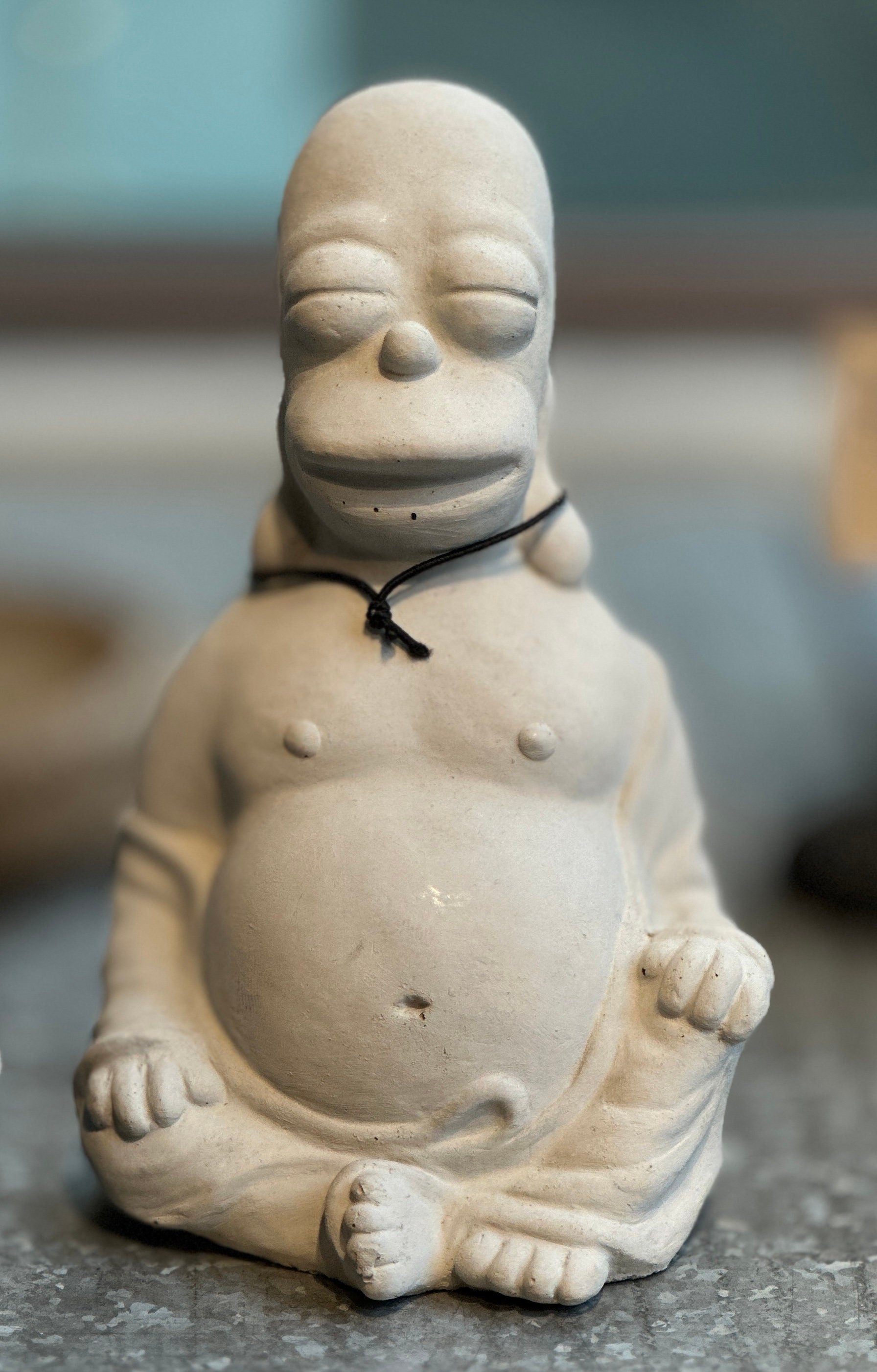 Homer Simpson Buddha concrete by Jon Ansted